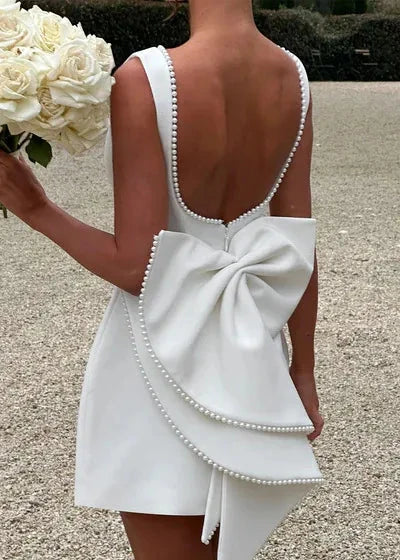 Pearl Trim Boat Neck Box Pleat Back Bow A-Line Mini Dress