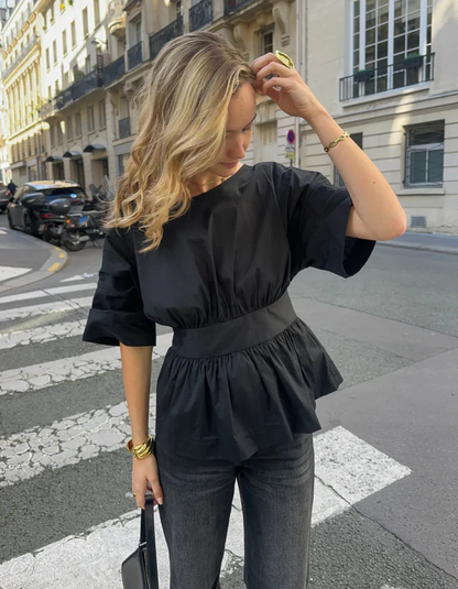 | Open-back peplum blouse