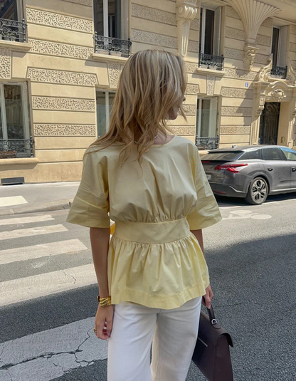 | Open-back peplum blouse