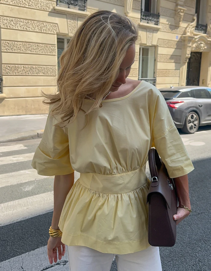 | Open-back peplum blouse