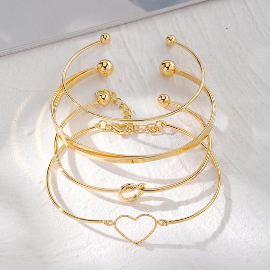 4-Piece Creative Heart Crossed Alloy Bangle Bracelet Set