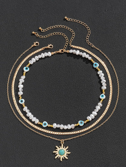 Turquoise and Pearl Layered Necklace with Bohemian Sunburst 디자인