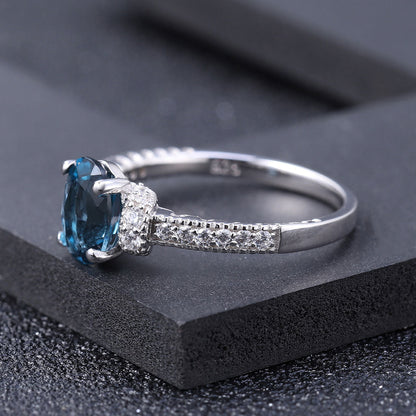 Cubic Zirconia and London Blue Topaz Halo Ring