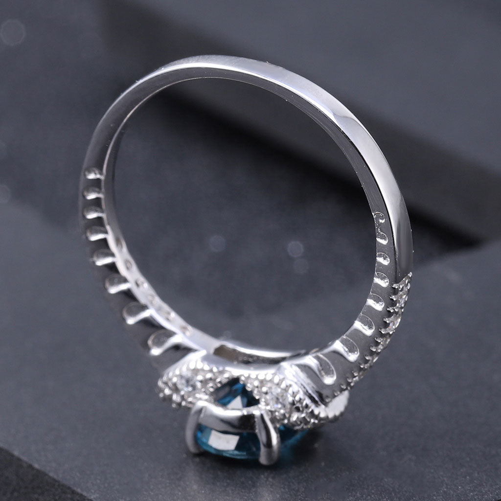 Cubic Zirconia and London Blue Topaz Halo Ring