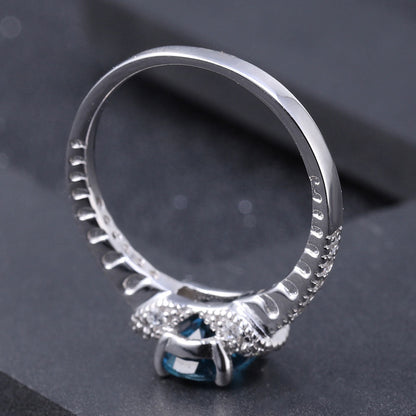 Cubic Zirconia and London Blue Topaz Halo Ring