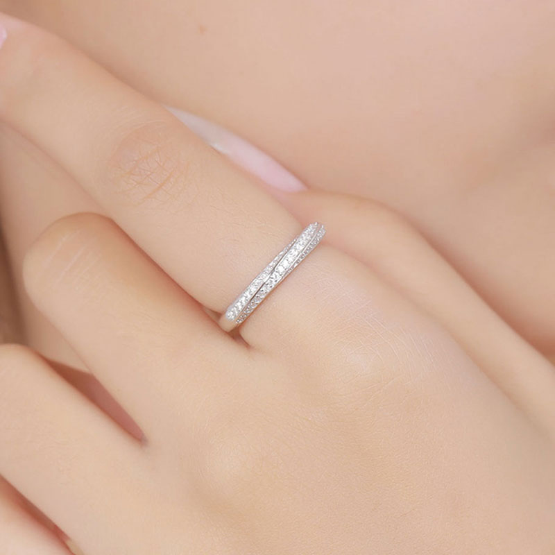 Rhodium Plated Sterling Silver Twisted Ring with Round Cut Moissanite Pave