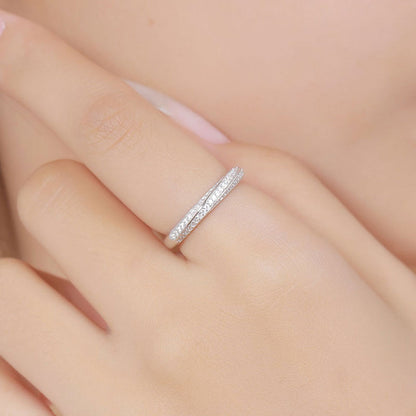 Rhodium Plated Sterling Silver Twisted Ring with Round Cut Moissanite Pave