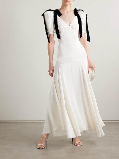 Velvet bow embellished white gown